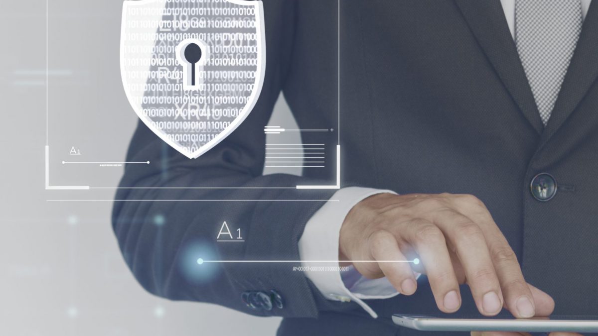 Business man logging into his tablet to control his security system